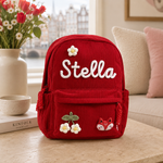 Roter Cord-Kinderrucksack mit Namen Stella, Blumen und Fuchs-Anhänger