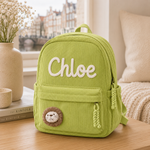Grüner Cord-Rucksack mit Namen Chloe und Löwen-Applikation für Kita und Schule